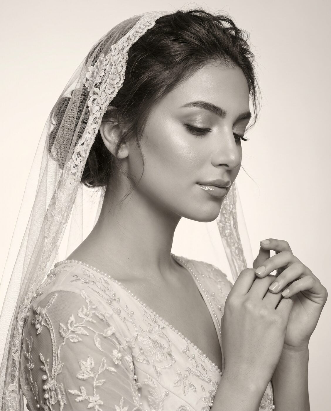 Bride with sheer veil, looking down